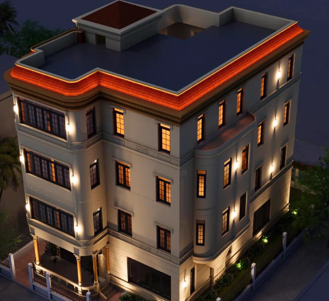 Song Giong Villa at night: four cream storeys with lit windows, a red tiled roof edge, a rounded corner bay over the porch and a fenced garden.